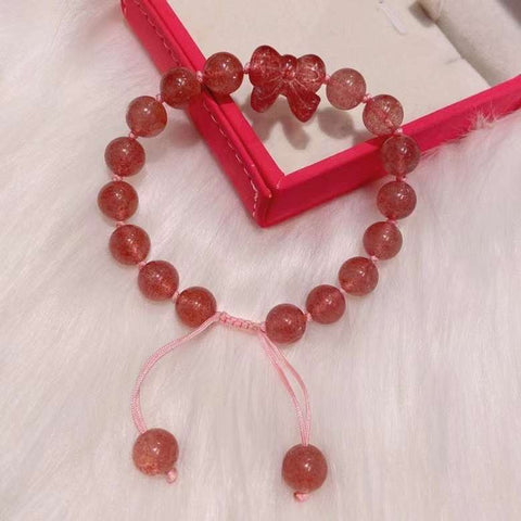 Strawberry crystal 9mm bracelet, with strawberry crystal carved bow, hand braided rope