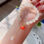 Natural white moonlight 8mm bracelet, with South Red Peach pendant, 14K Gold covered extension chain