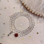 Natural white crystal 6mm two circle bracelet. With cinnabar cat paw p