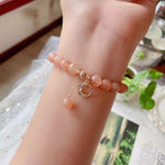 Natural sun stone 8mm bracelet with 14K gold wrapped little moon penda