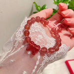 Strawberry crystal 9mm bracelet, with strawberry crystal carved bow, hand braided rope