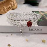 Natural white crystal 6mm two circle bracelet. With cinnabar cat paw p