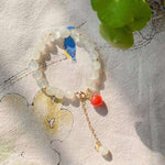 Natural white moonlight 8mm bracelet, with South Red Peach pendant, 14K Gold covered extension chain