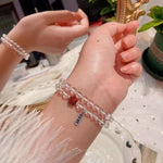 Natural white crystal 6mm two circle bracelet. With cinnabar cat paw p
