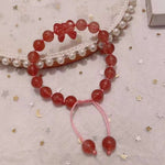 Strawberry crystal 9mm bracelet, with strawberry crystal carved bow, hand braided rope