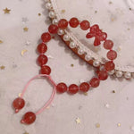 Strawberry crystal 9mm bracelet, with strawberry crystal carved bow, hand braided rope
