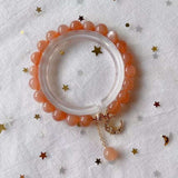 Natural sun stone 8mm bracelet with 14K gold wrapped little moon penda