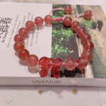Strawberry crystal 9mm bracelet, with strawberry crystal carved bow, hand braided rope